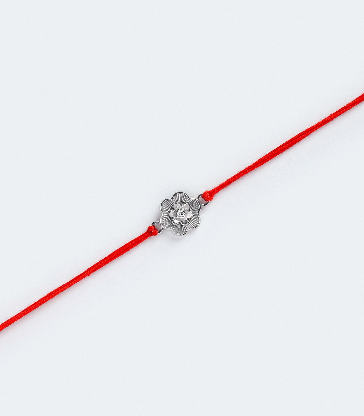 Dainty Floral Motif Silver Rakhi