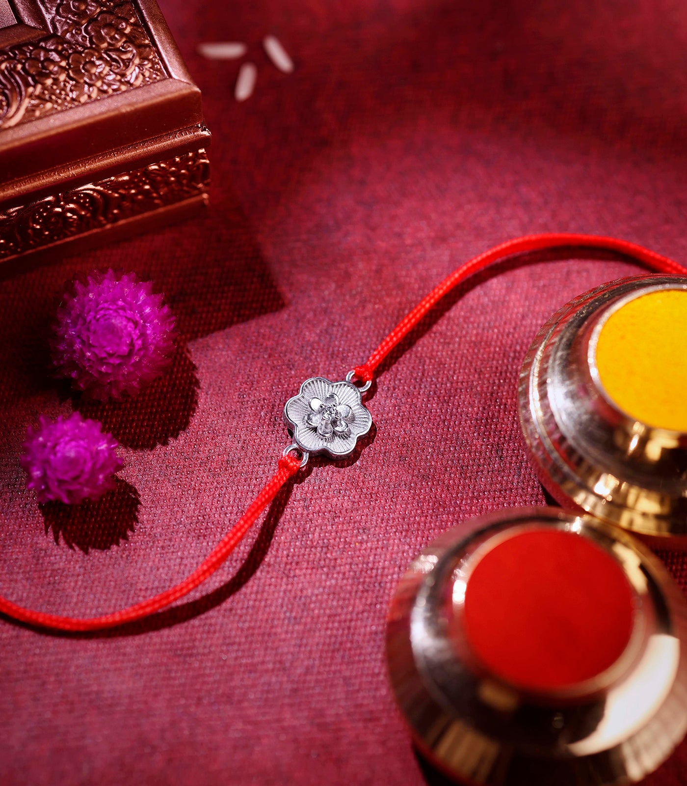 Dainty Floral Motif Silver Rakhi