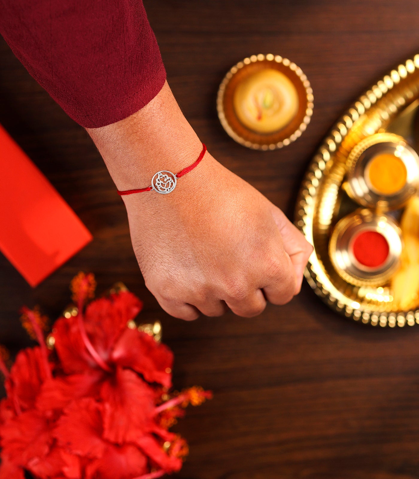 Gleaming Silver Rakhi - Divine Ganesh Design