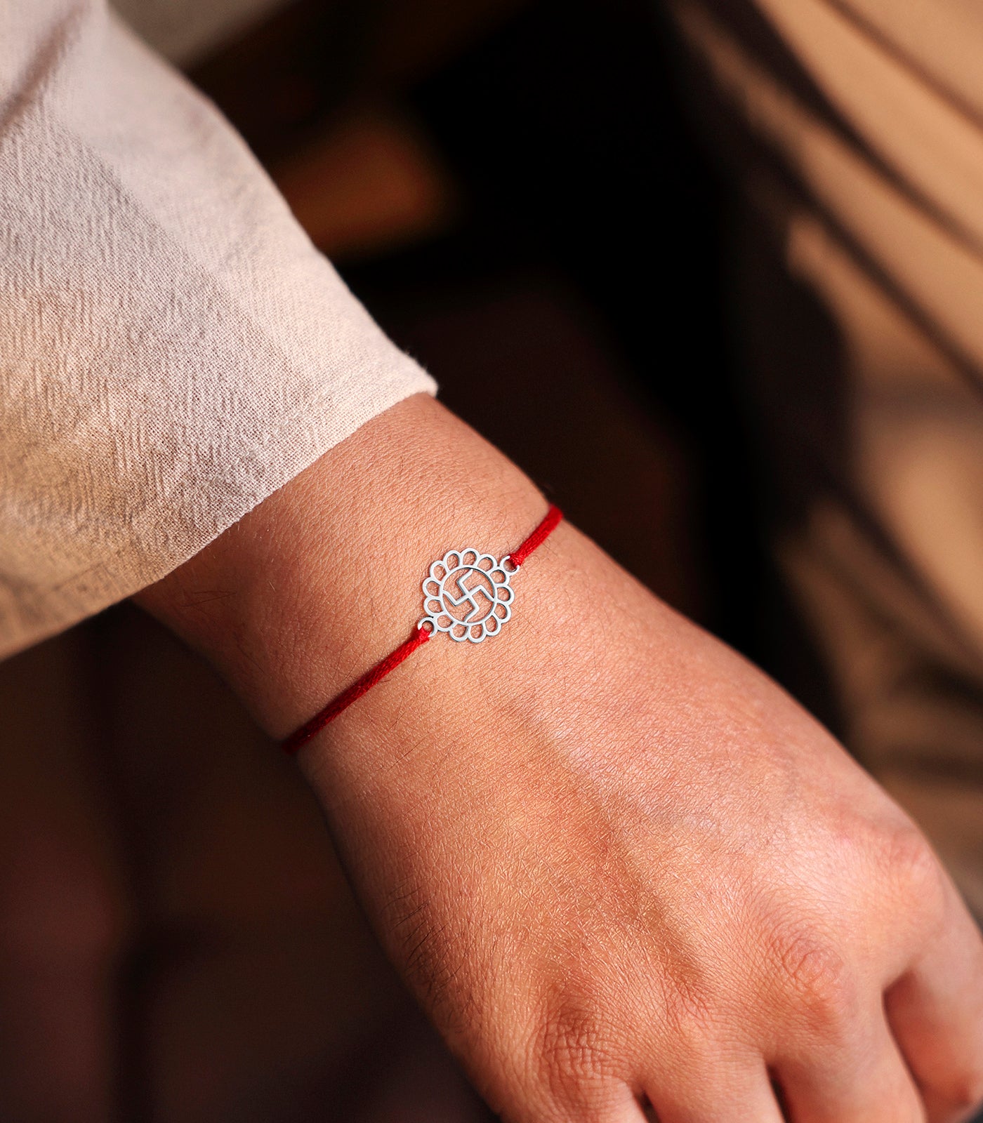 Elegant Silver Rakhi - Divine Swastik Design