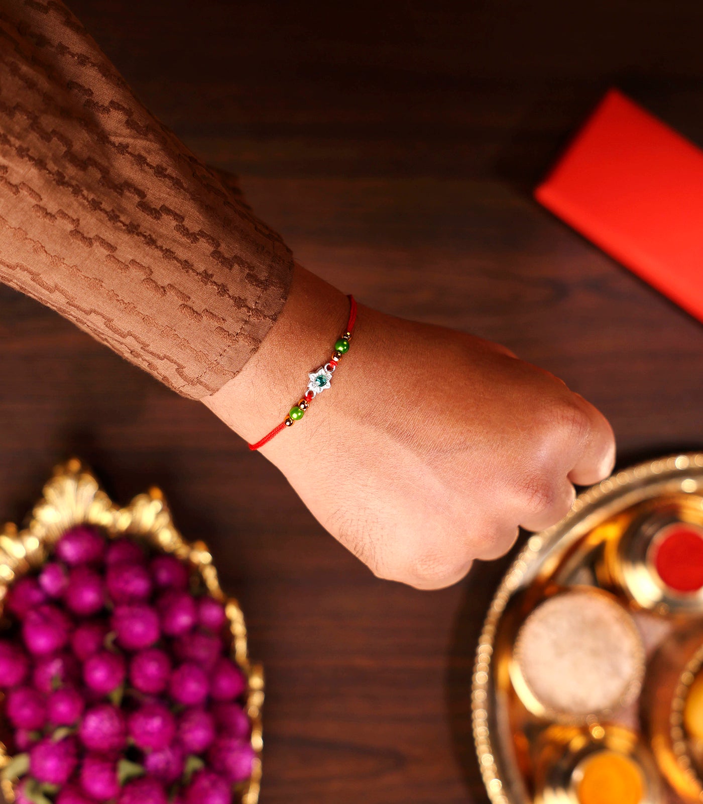 Silver Rakhi - Delicate Green Stone Floral Design