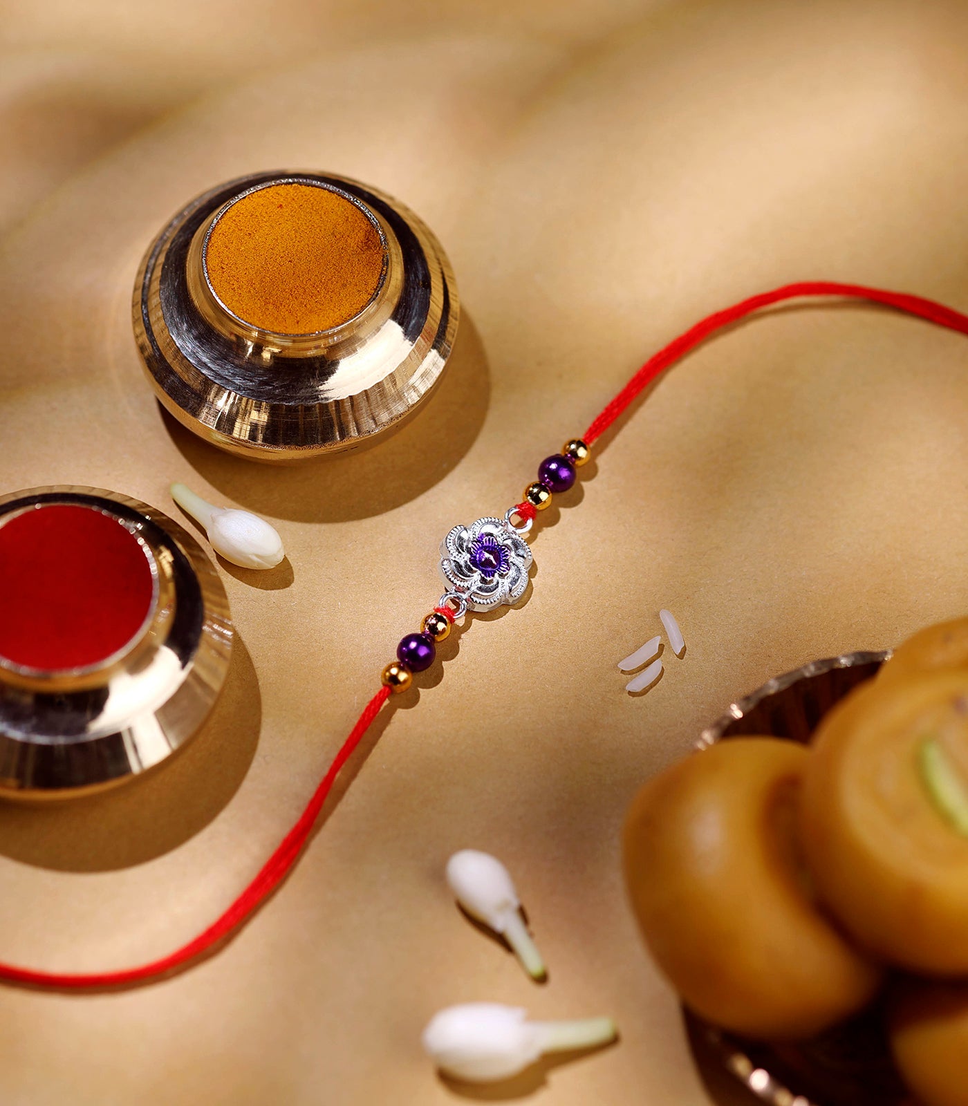 Silver Rakhi - Violet Floral Design