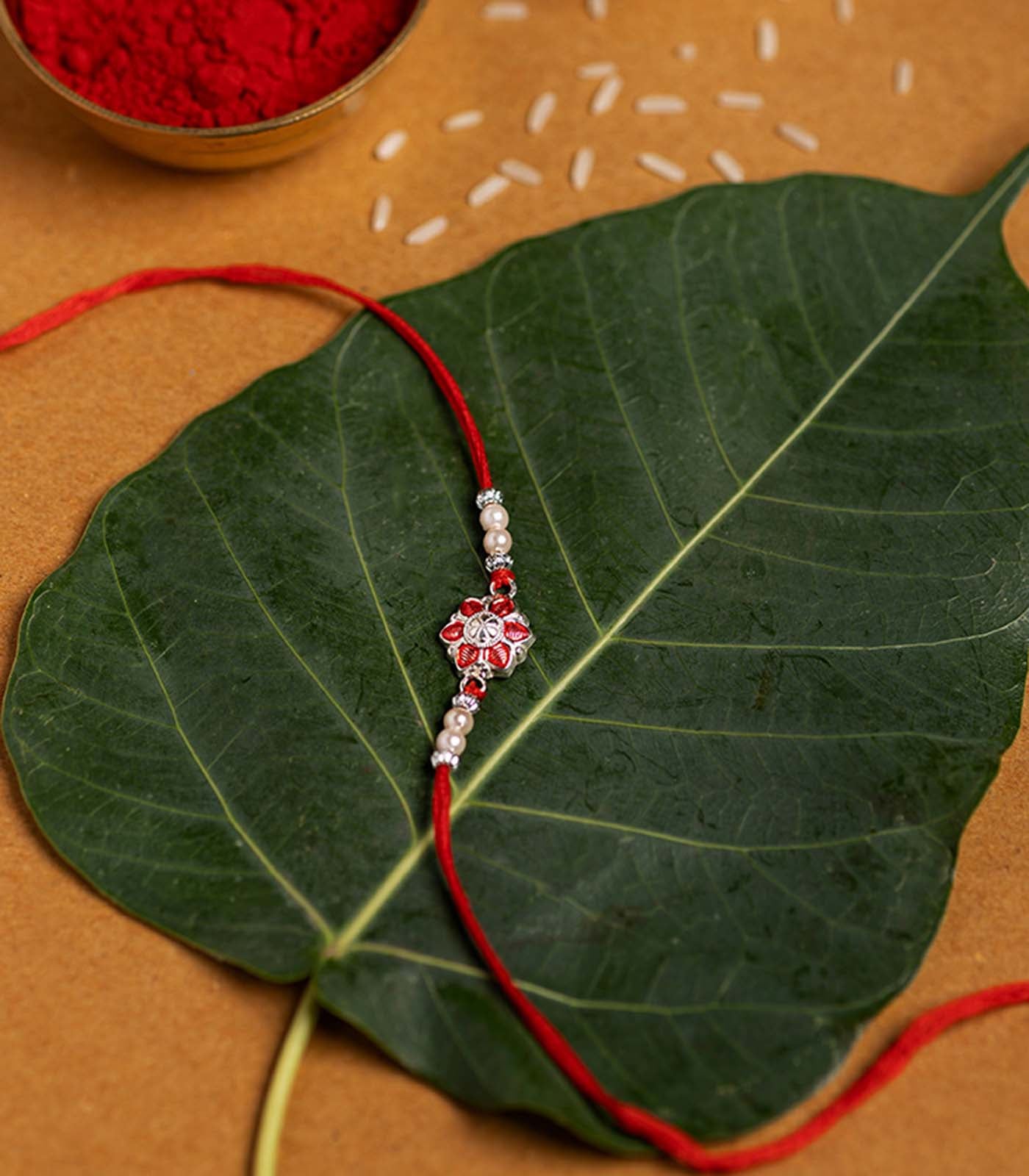 Beautiful Silver Rakhi - Red Petal Floral Design