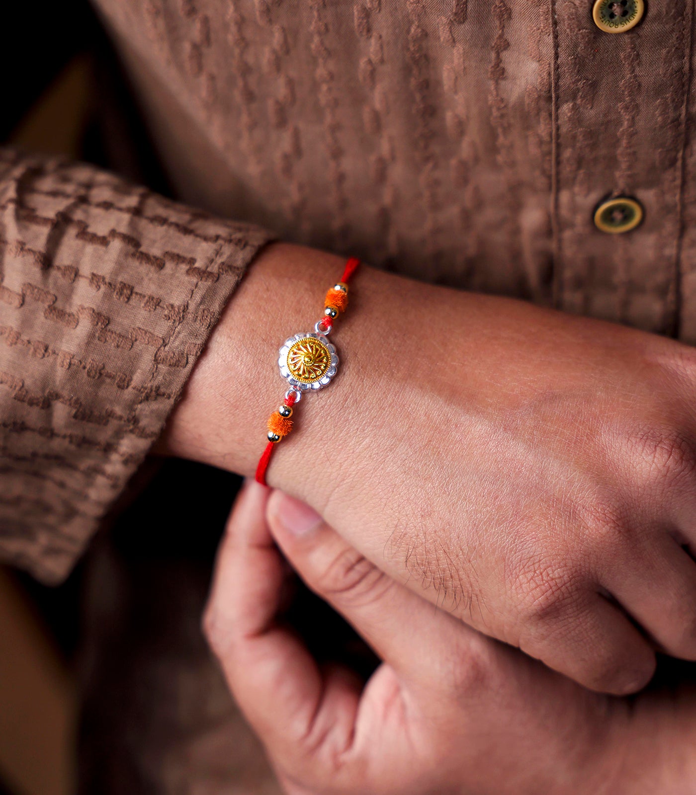 Beautiful Silver Rakhi - Golden Petals Design