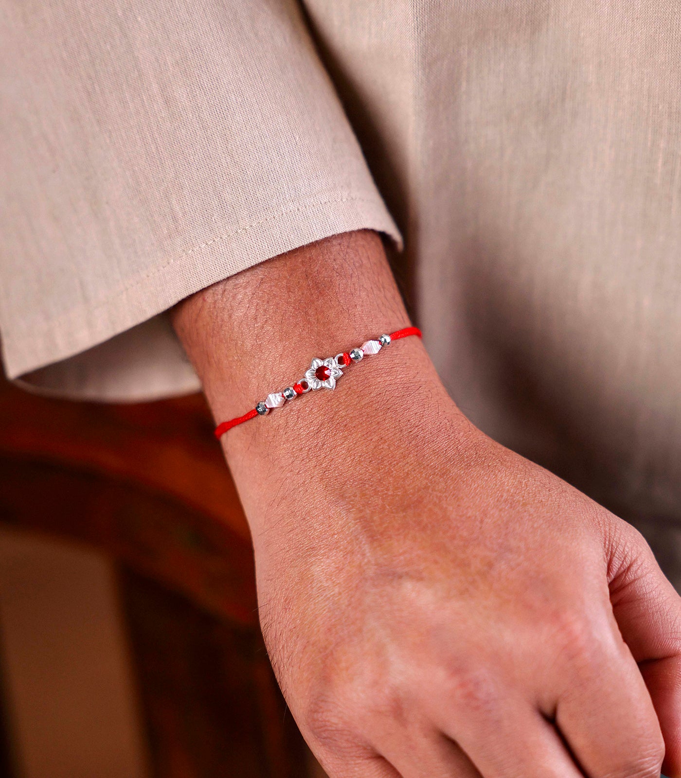 Beautiful Silver Rakhi - Red Stone Delicate floral Design