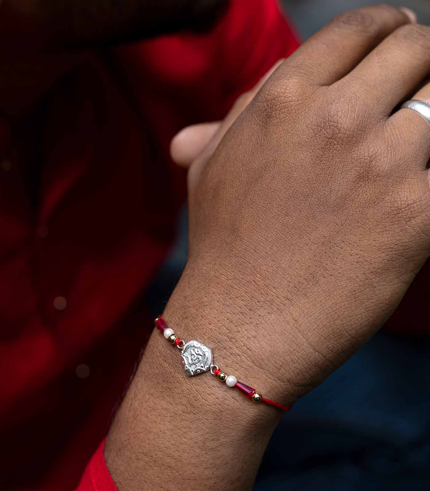 Stunning Silver Rakhi - OM Engraved Heart Design