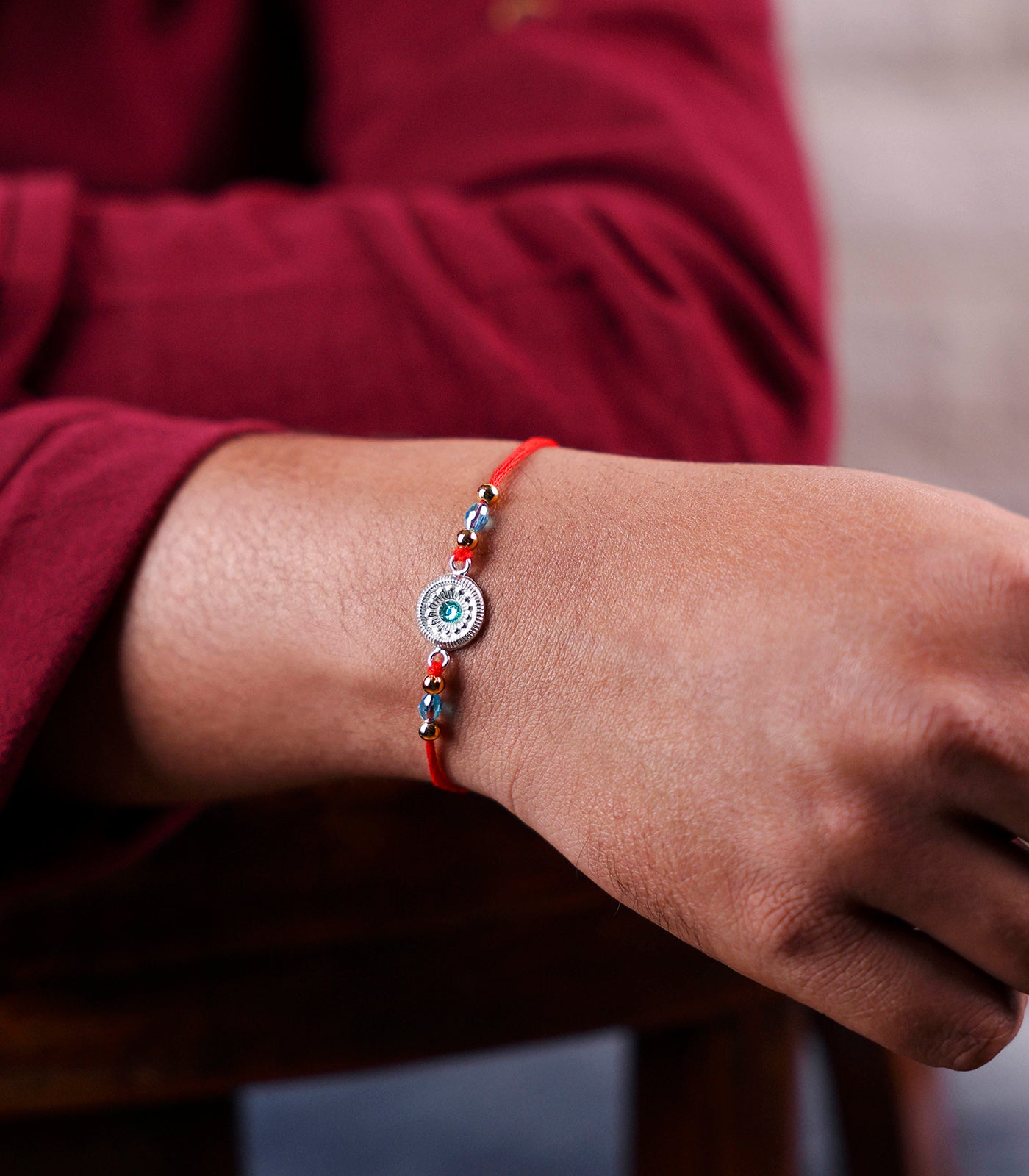 Beautiful Silver Rakhi - Round Shape Aqua Blue Stone Design