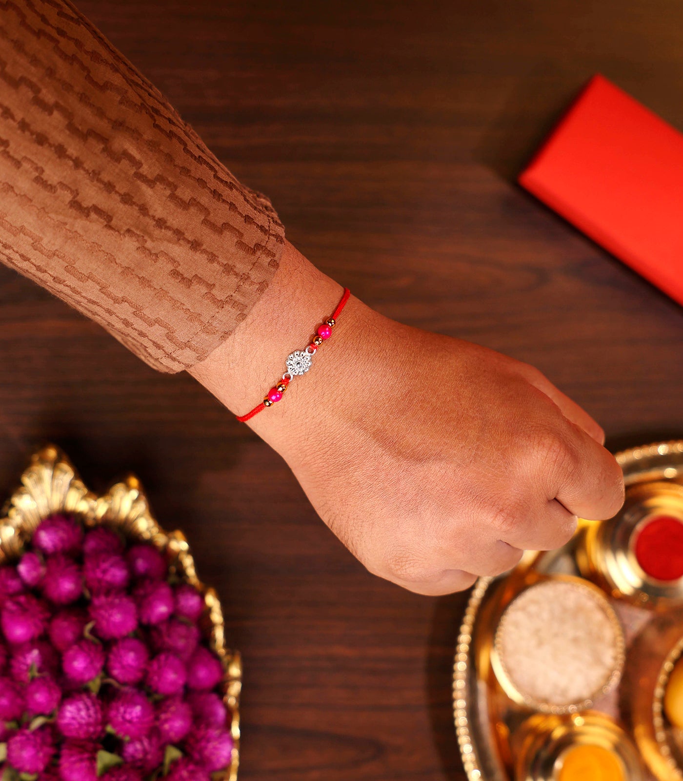 Silver Rakhi - The delicate petal motif design