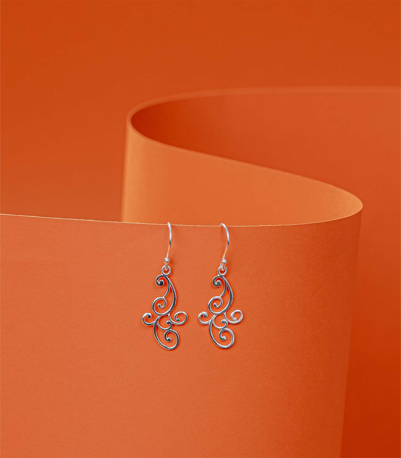 Dangling Outlined Swirls Earrings (Silver)