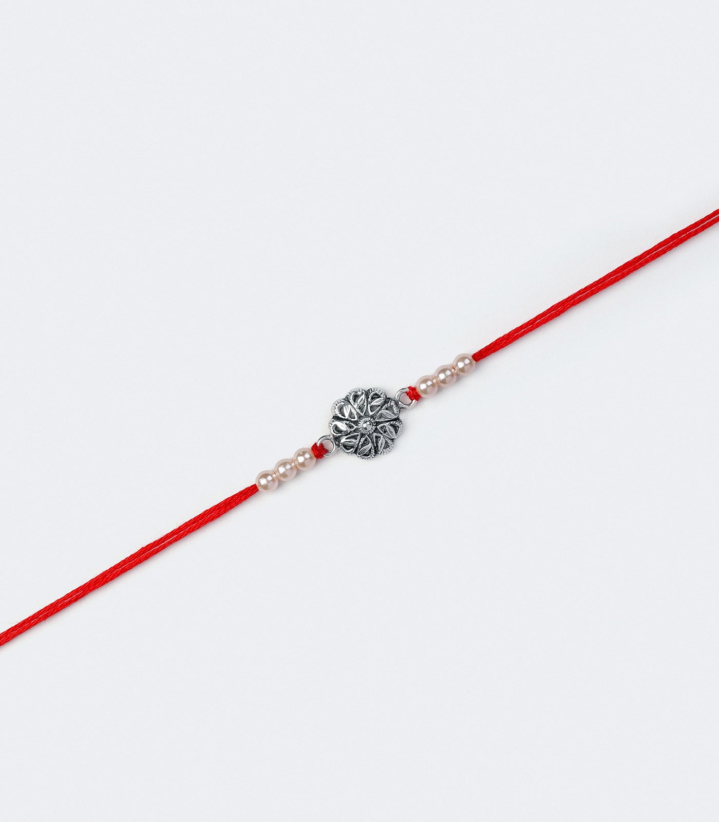 Petal And Leaf Motif Silver Rakhi