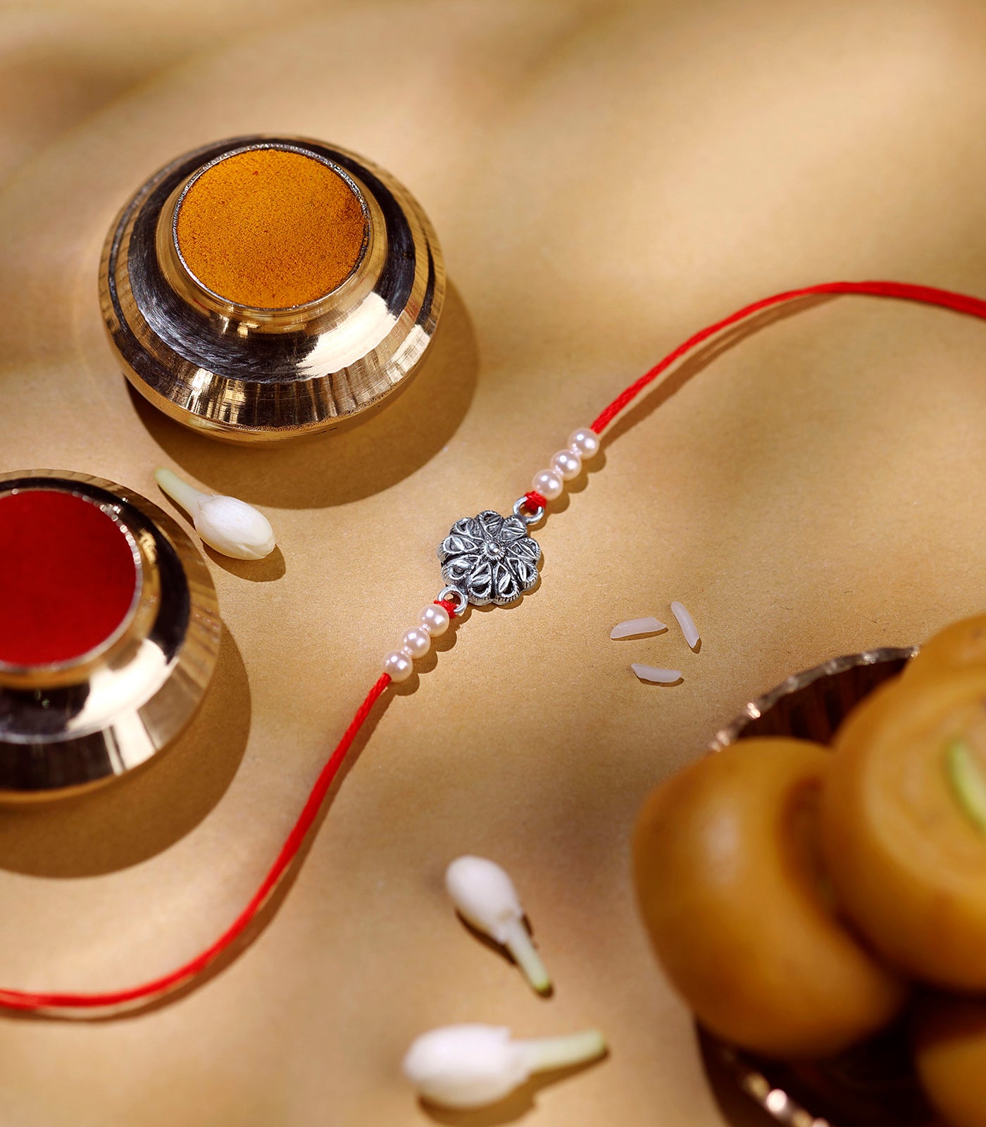 Petal And Leaf Motif Silver Rakhi