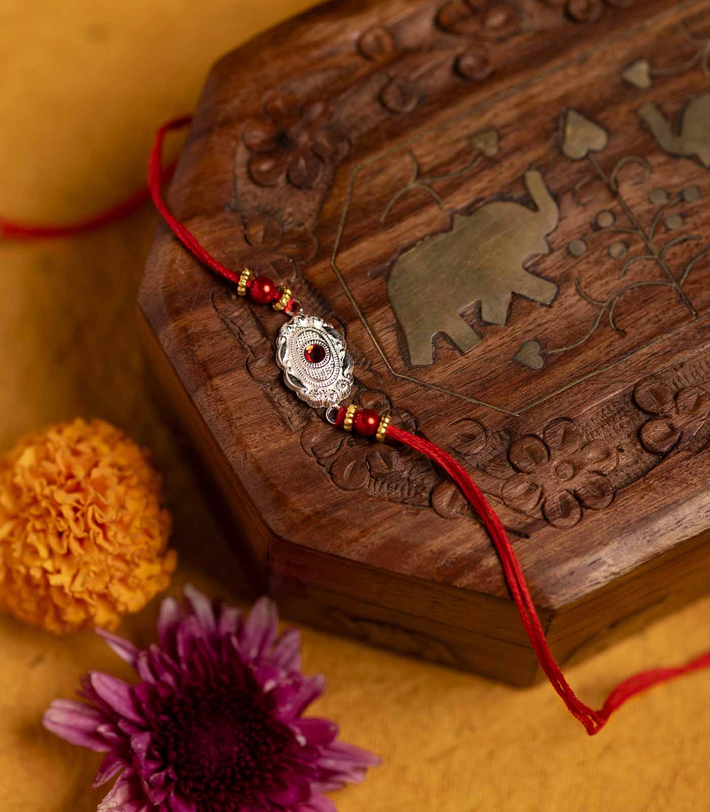 Silver Red Stone Oval Shaped Rakhi