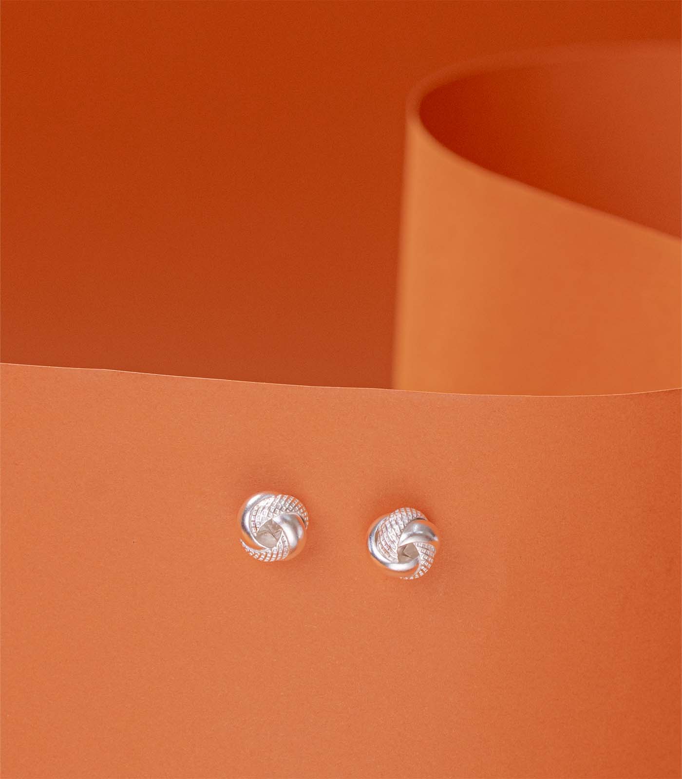 Interlocked Round Orbits Dual Textured Silver Tops