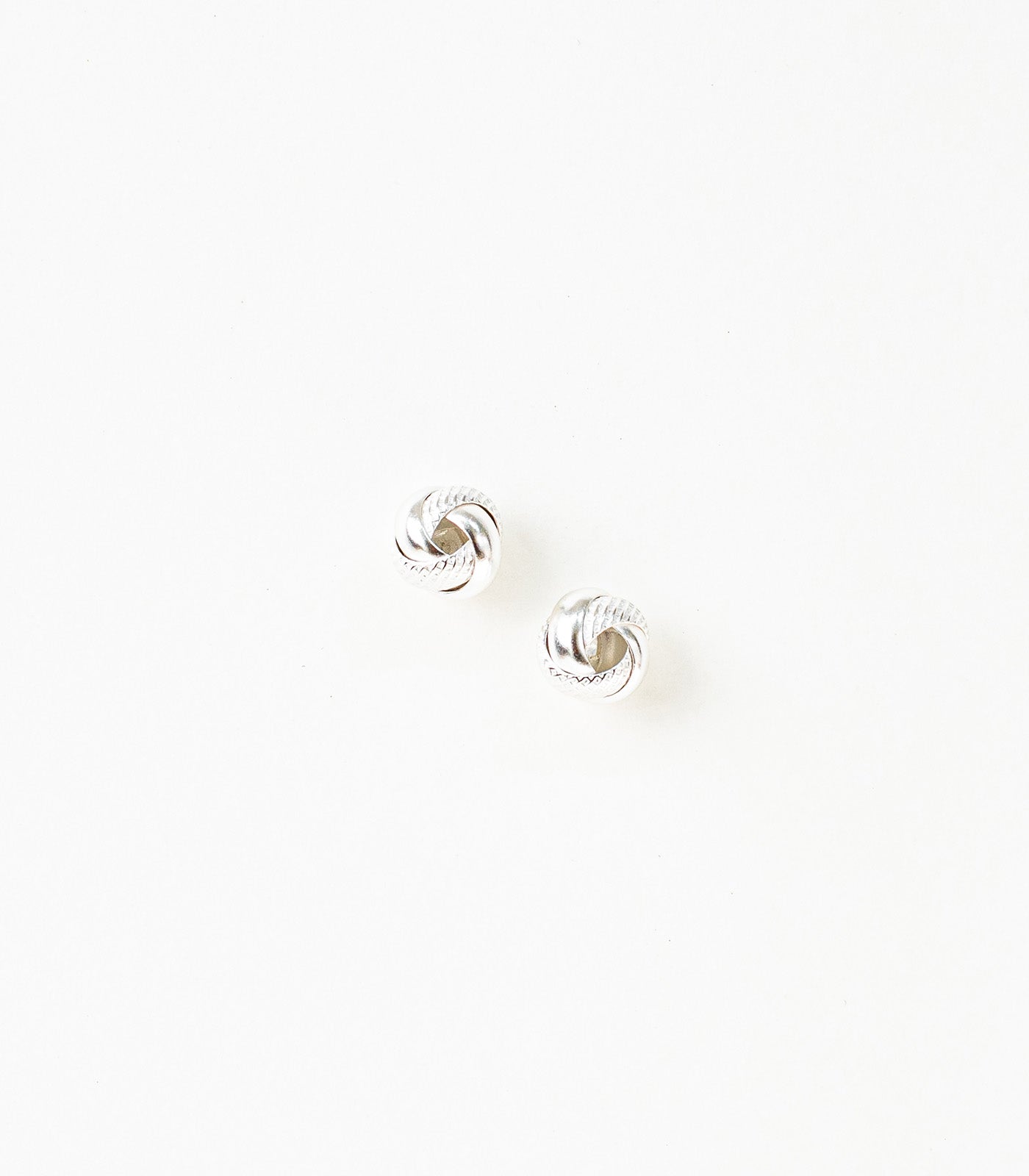 Interlocked Round Orbits Dual Textured Silver Tops