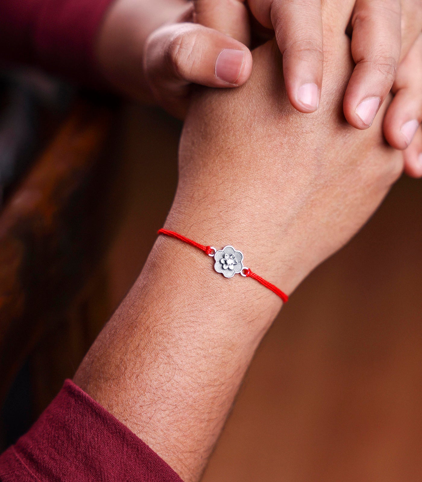 Dainty Floral Motif Silver Rakhi