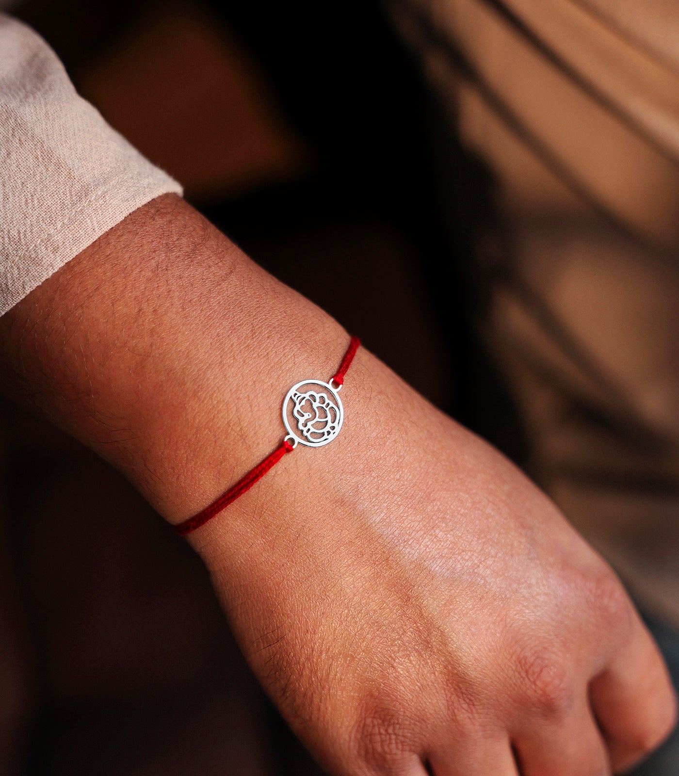 Gleaming Silver Rakhi - Divine Ganesh Design