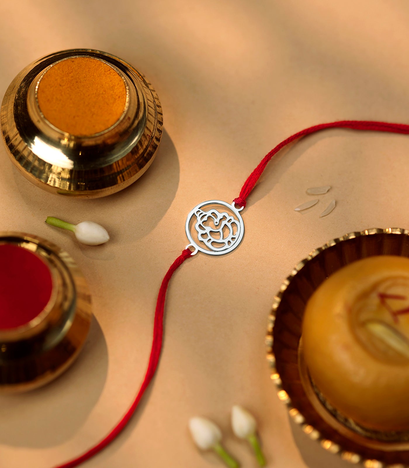 Gleaming Silver Rakhi - Divine Ganesh Design