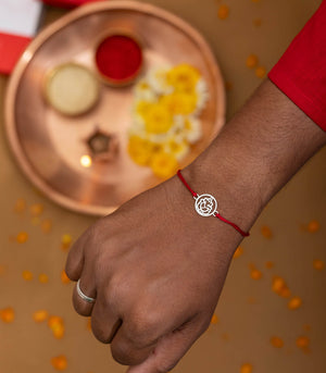 Gleaming Silver Rakhi - The Divine Ganesha Cut Out Design