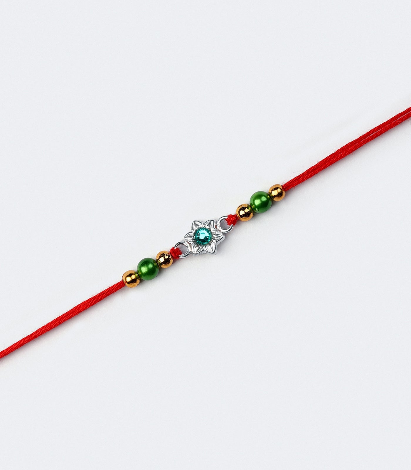 Silver Rakhi - Delicate Green Stone Floral Design
