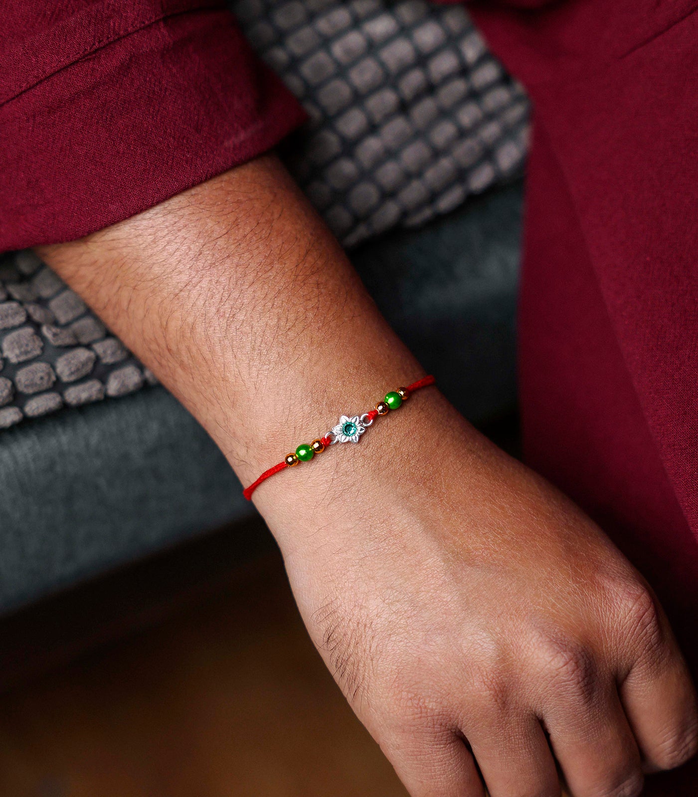 Silver Rakhi - Delicate Green Stone Floral Design