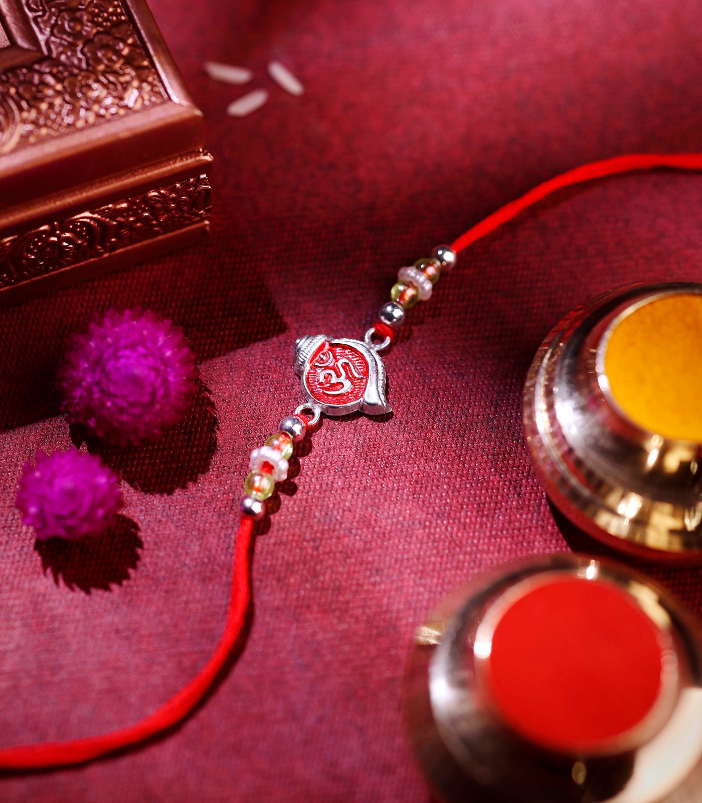 Stunning Silver Rakhi - The Elegant Om engraved Shankh Design