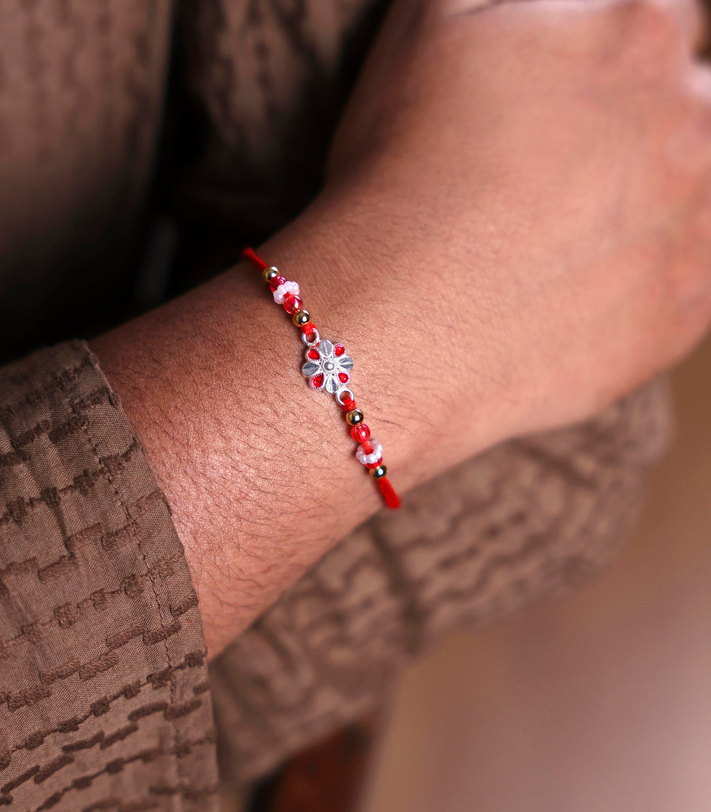 Stunning Silver Rakhi - Elegant Petal Design