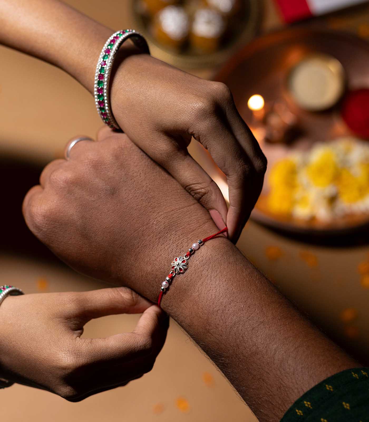 Stunning Silver Rakhi - Elegant Petal Design