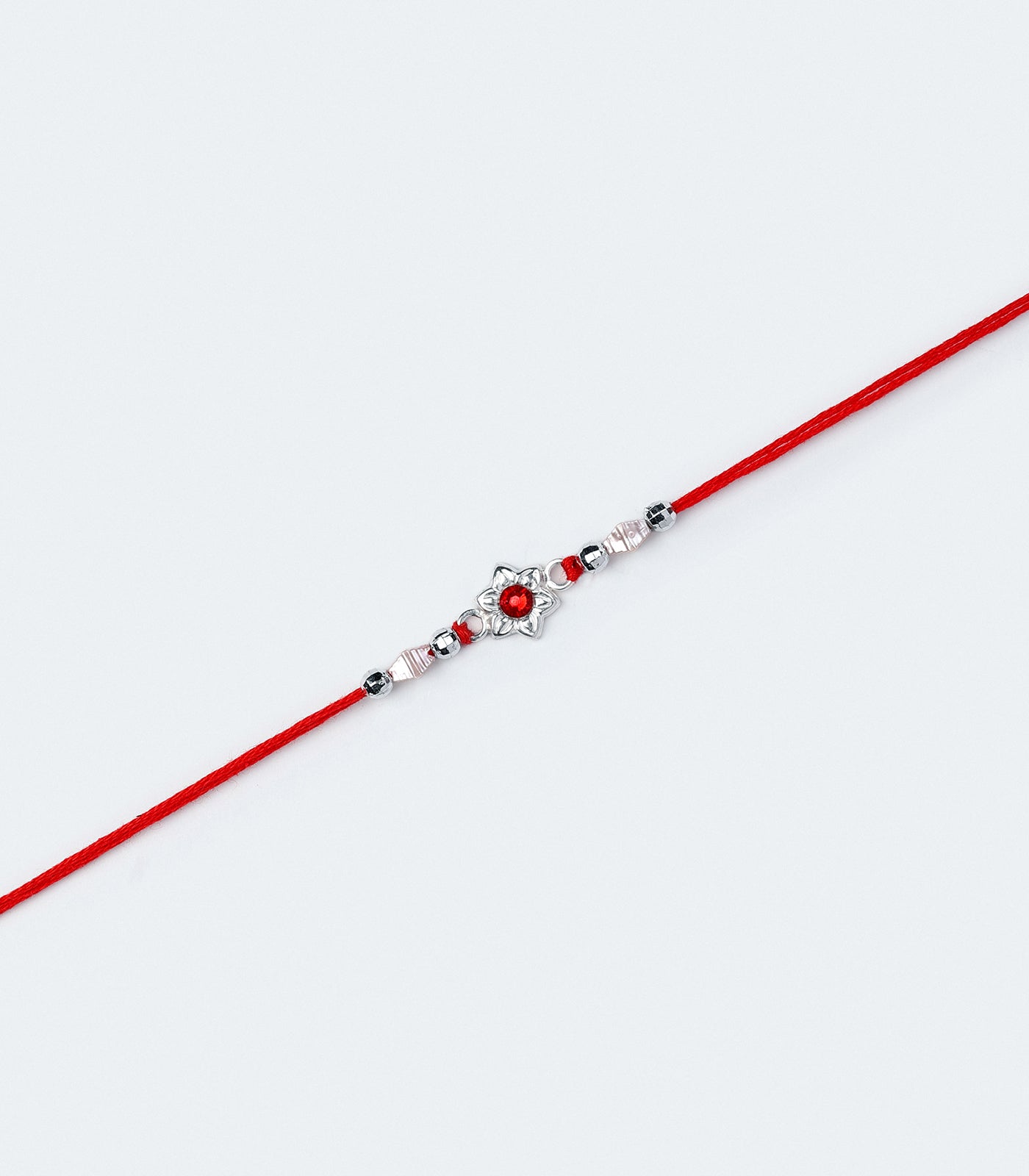 Beautiful Silver Rakhi - Red Stone Delicate floral Design