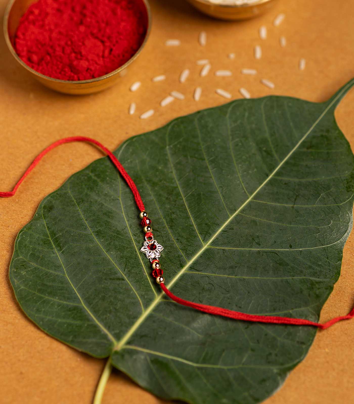 Beautiful Silver Rakhi - Red Stone Delicate floral Design