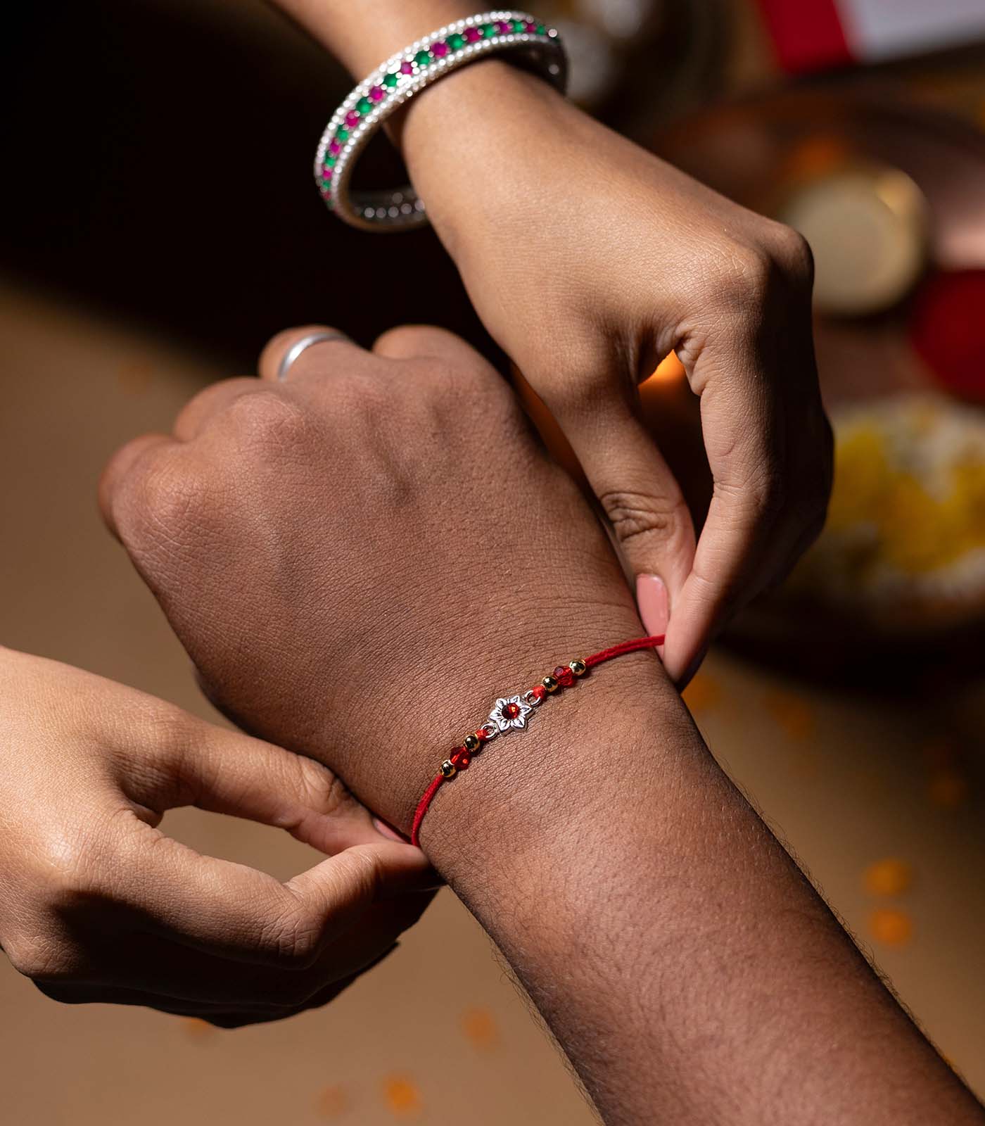 Beautiful Silver Rakhi - Red Stone Delicate floral Design