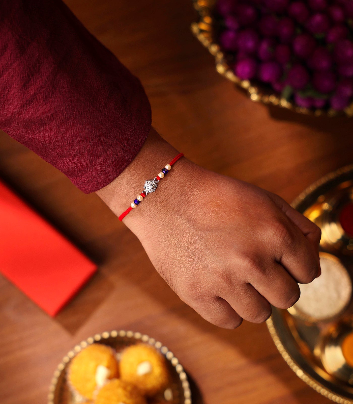 Stunning Silver Rakhi - The Elegant Star Flower Design