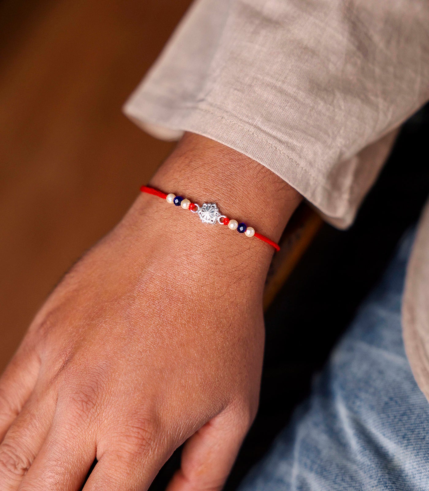 Stunning Silver Rakhi - The Elegant Star Flower Design