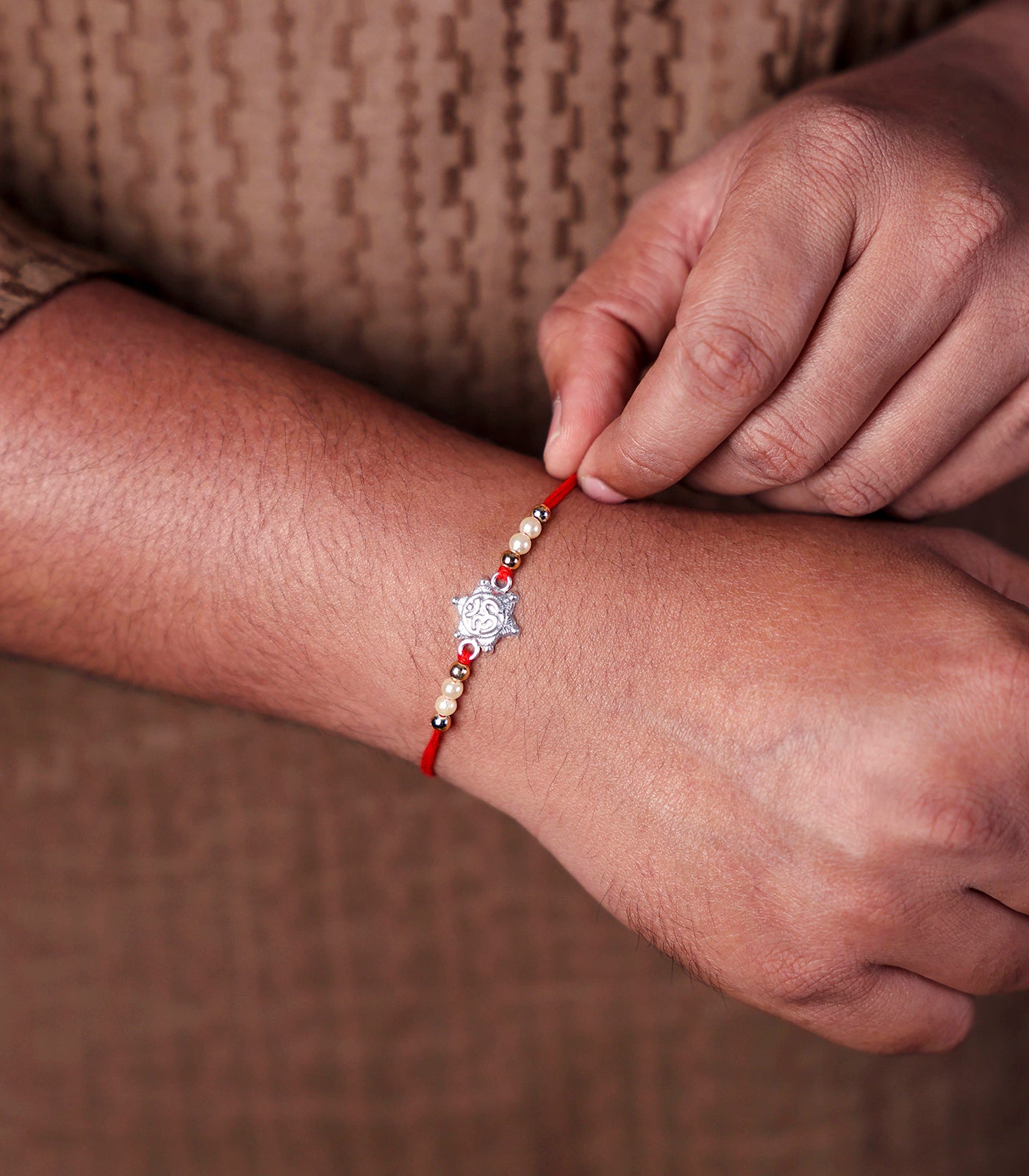 Stunning Silver Rakhi - OM Engraved Star Design