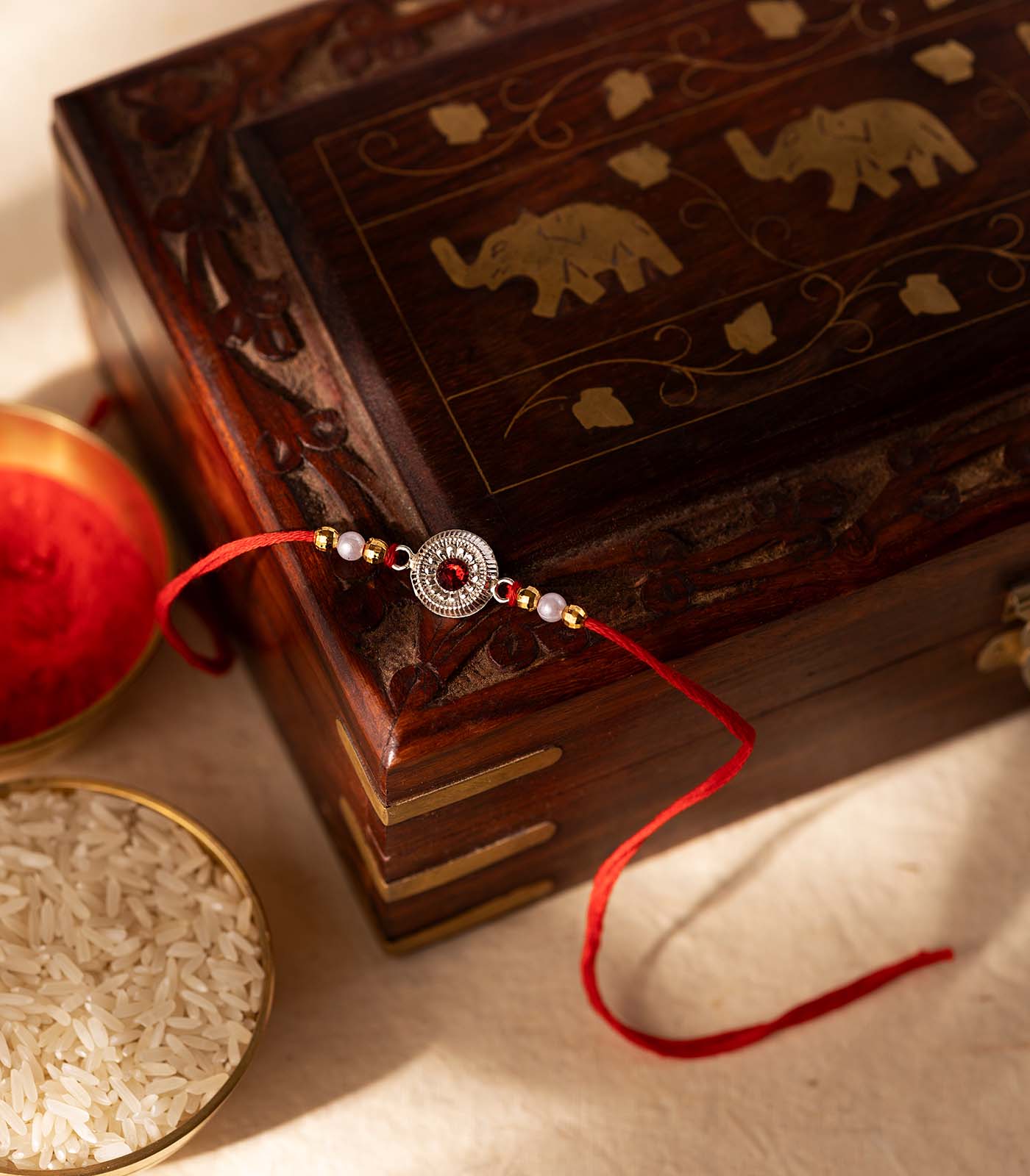 Stunning Silver Rakhi - The Elegant Elegant Triple Petal Design