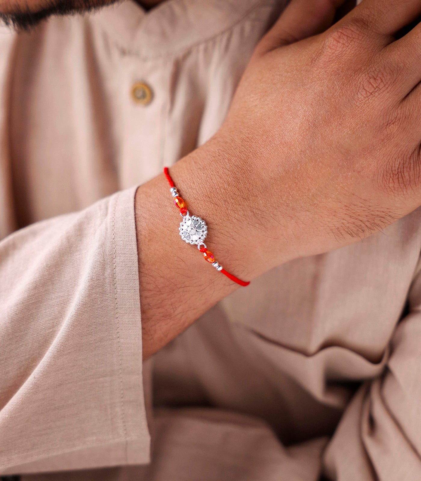 Stunning Silver Rakhi - The Elegant Heart Petal Design