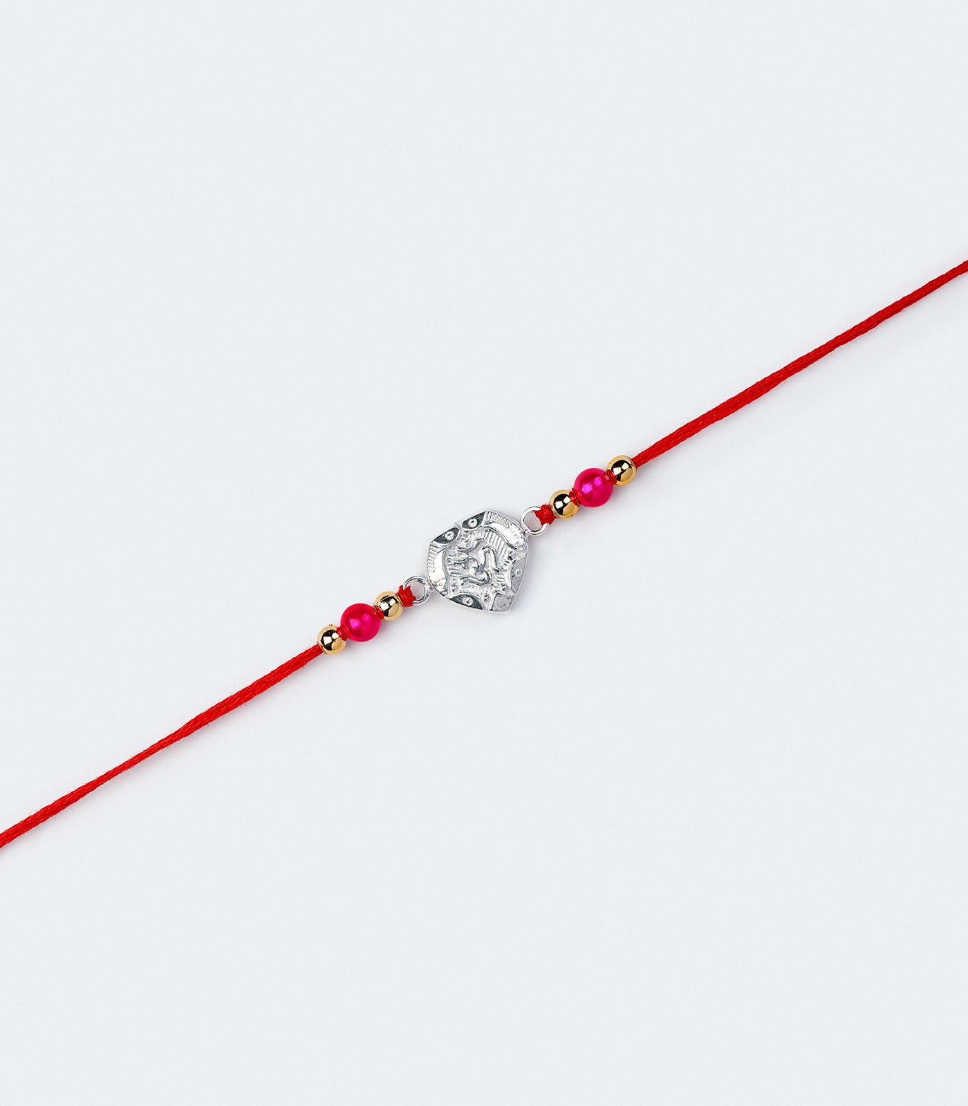 Stunning Silver Rakhi - OM Engraved Heart Design