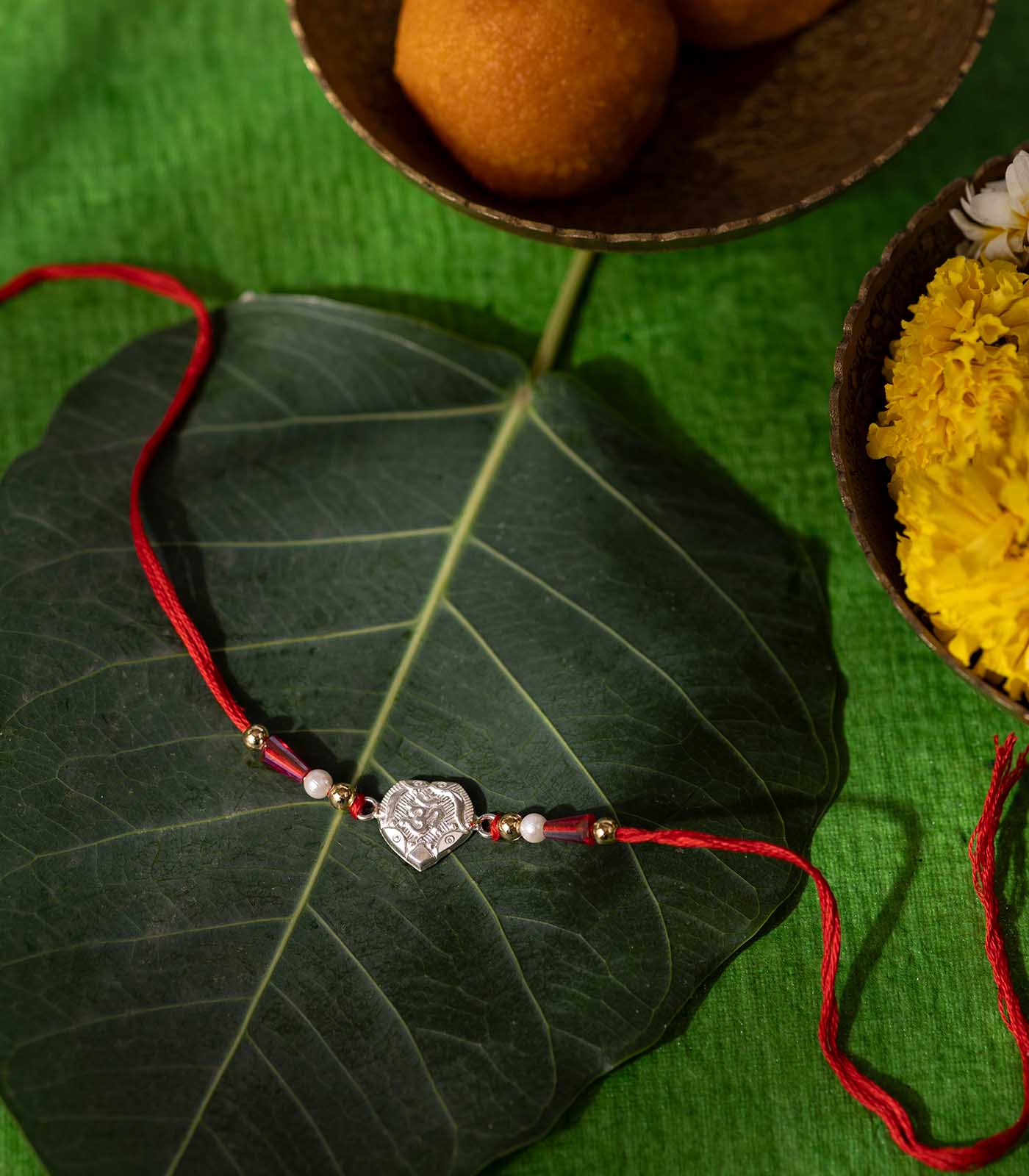 Stunning Silver Rakhi - The Elegant Elegant Triple Petal Round Design