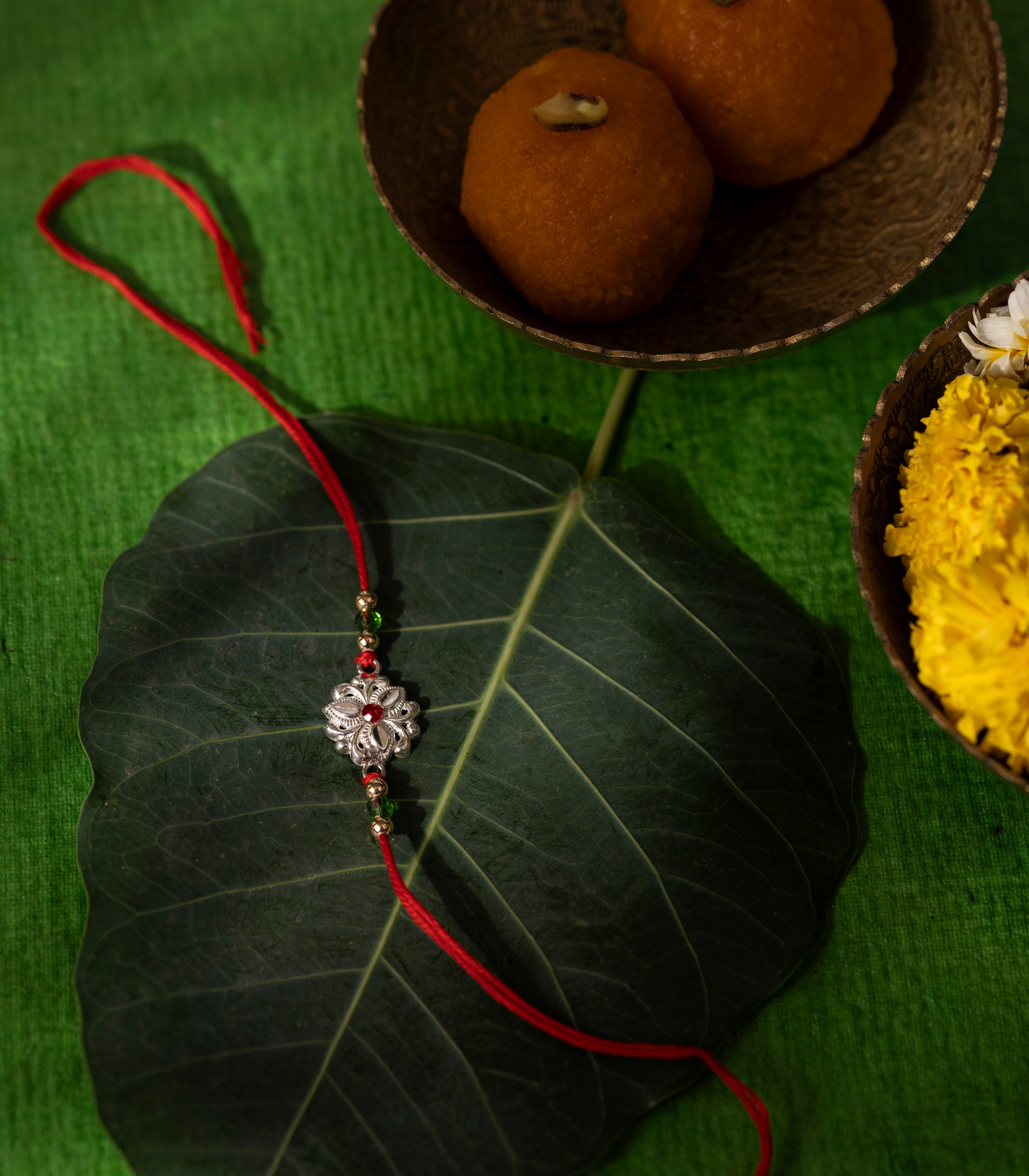 Beautiful Silver Rakhi - Delicate Tri-petal design
