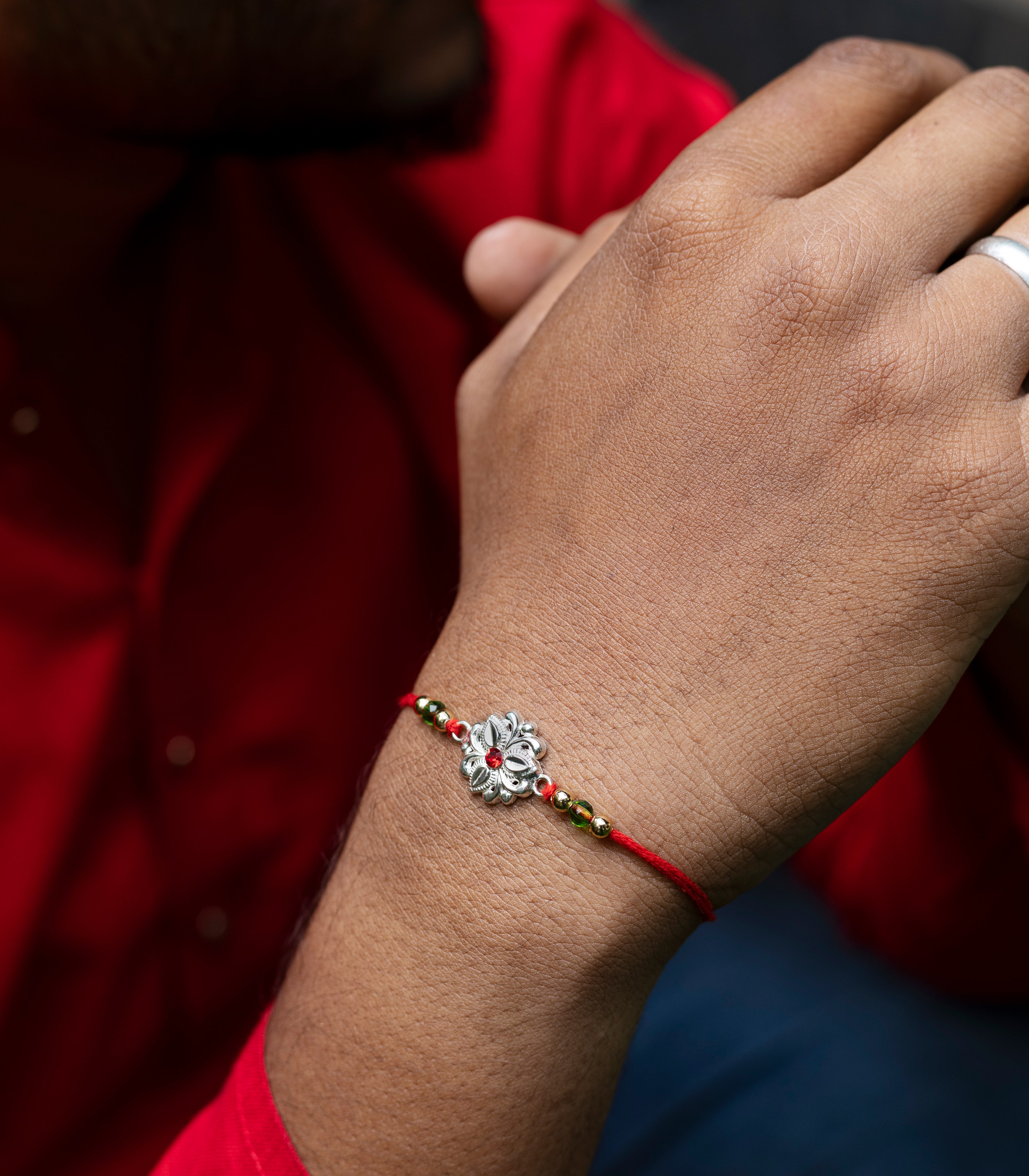 Beautiful Silver Rakhi - Delicate Tri-petal design