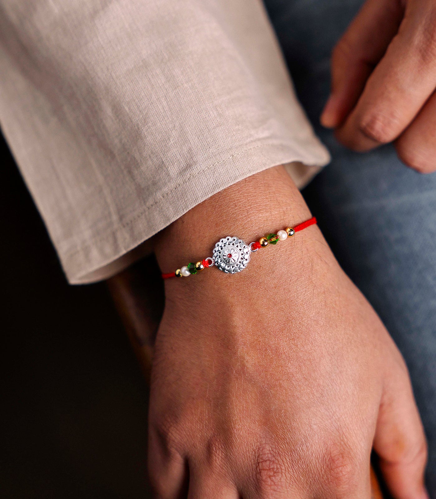 Stunning Silver Rakhi - The Elegant Multilayered Chakra Design