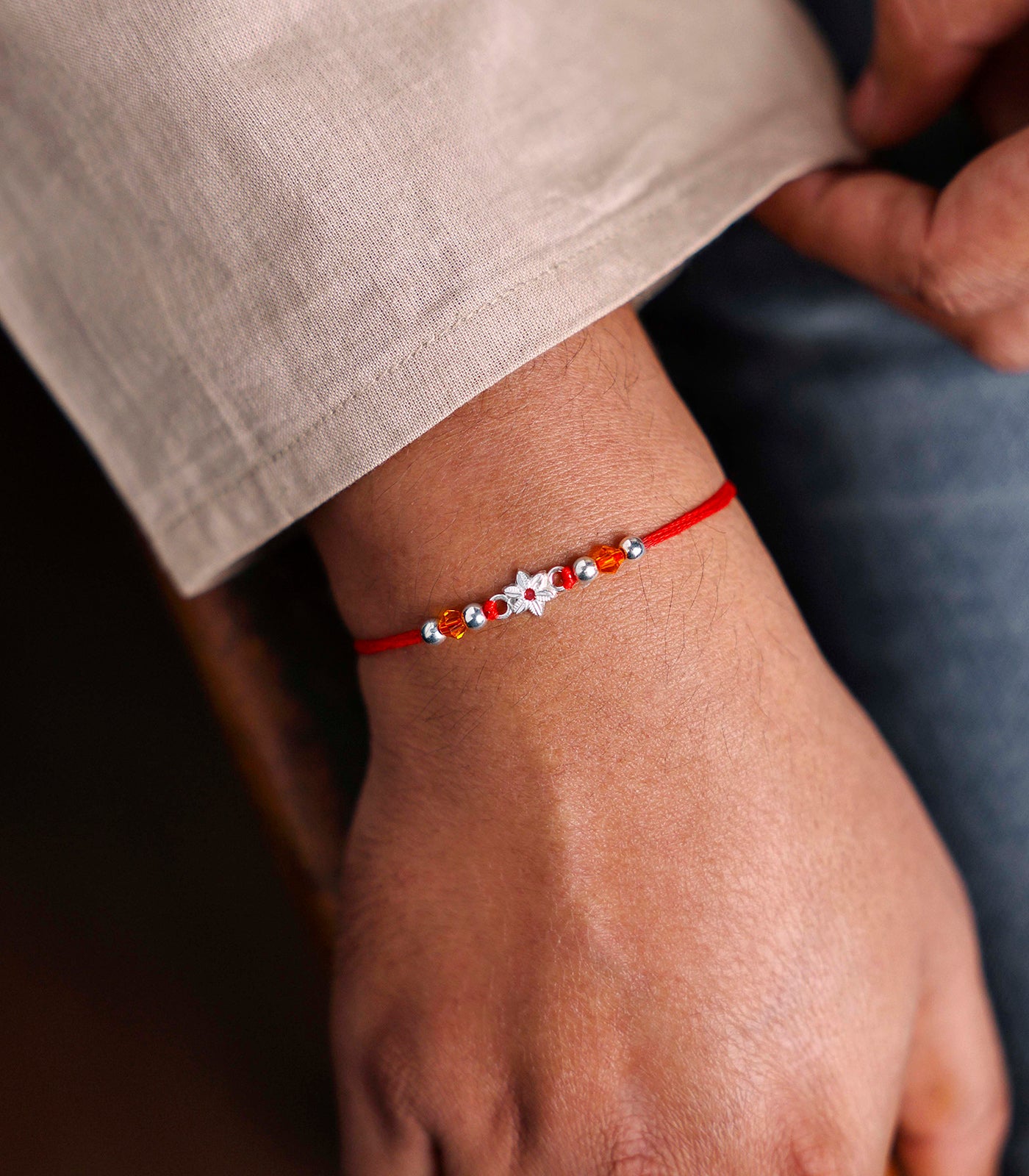 Stunning Silver Rakhi - The Elegant Floral Design