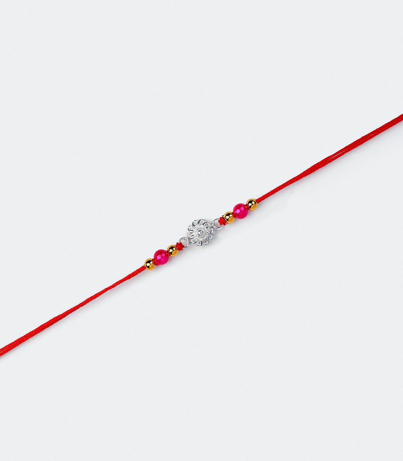 Silver Rakhi - The delicate petal motif design
