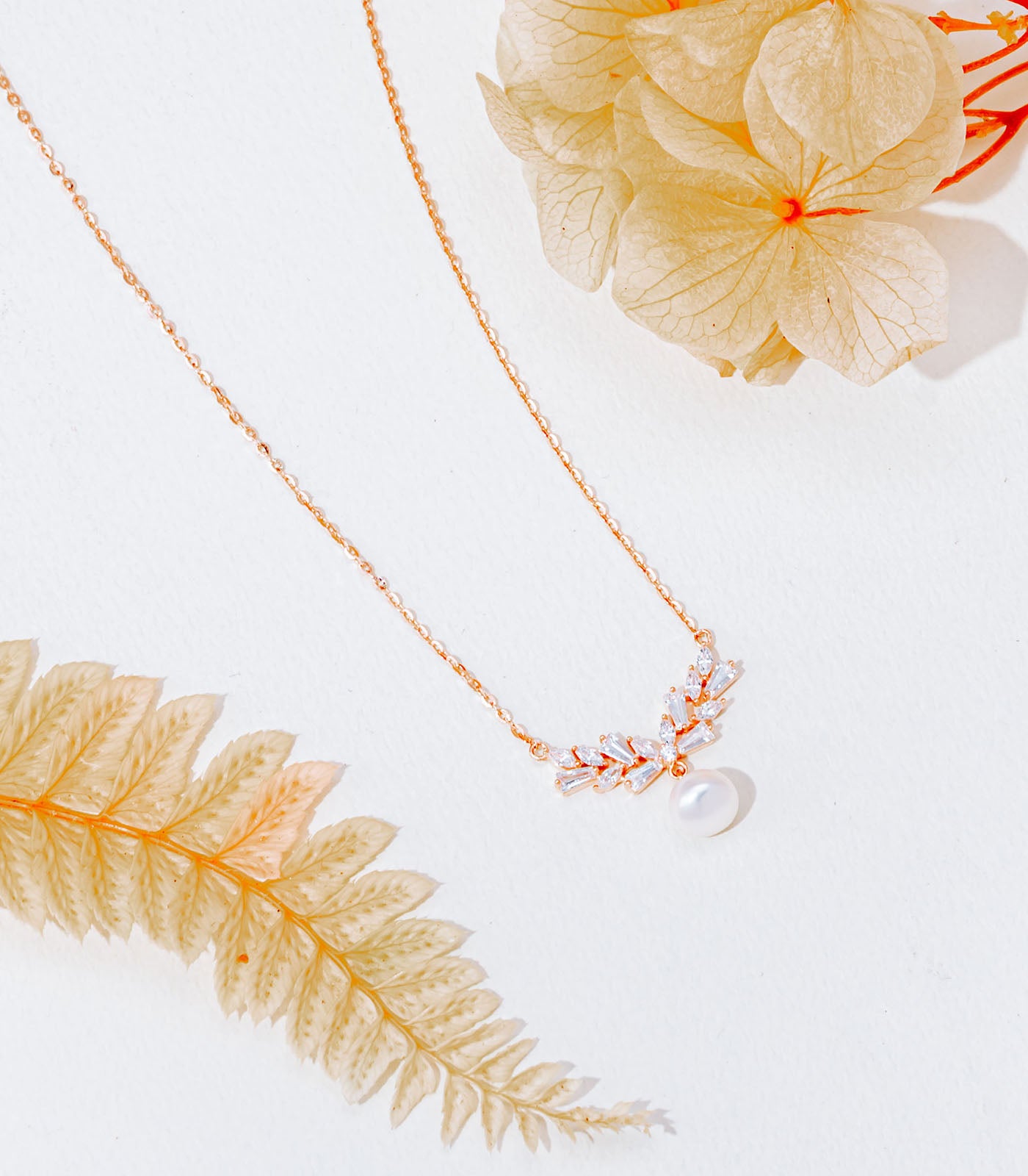 Dangling Bell And Pearl Gold Colour Necklace (Silver)