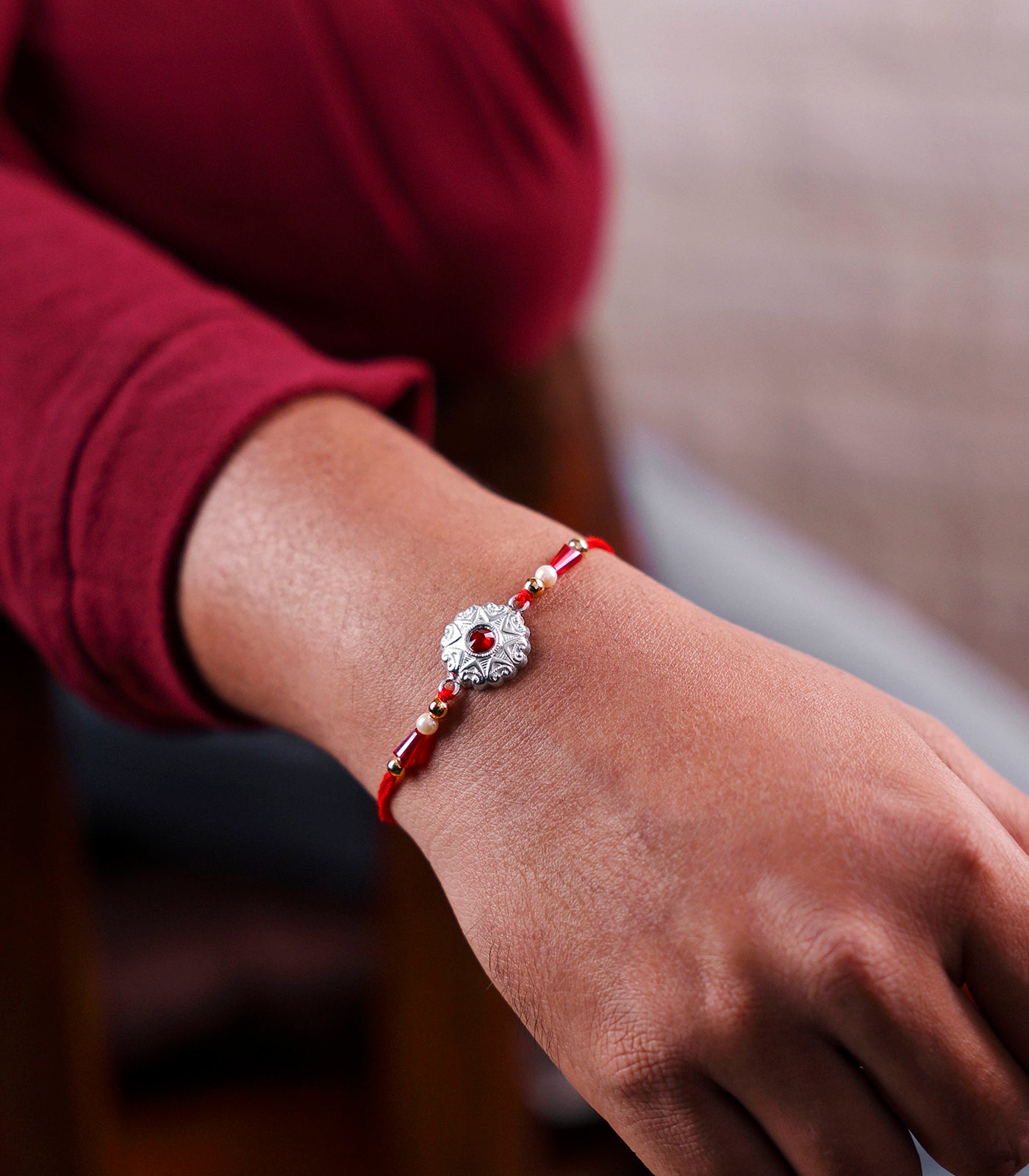 Silver Star Shaped Red Stone Rakhi