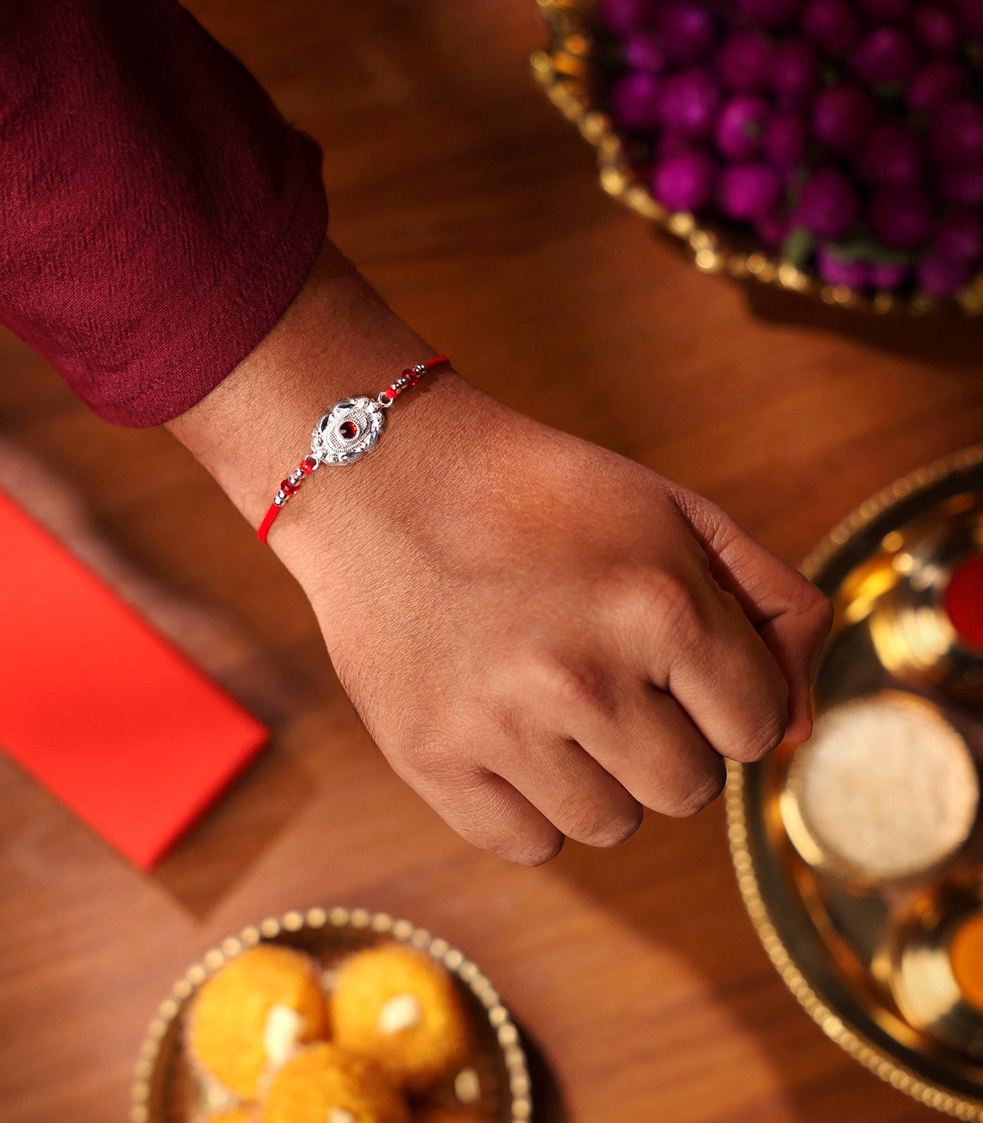 Silver Red Stone Oval Shaped Rakhi