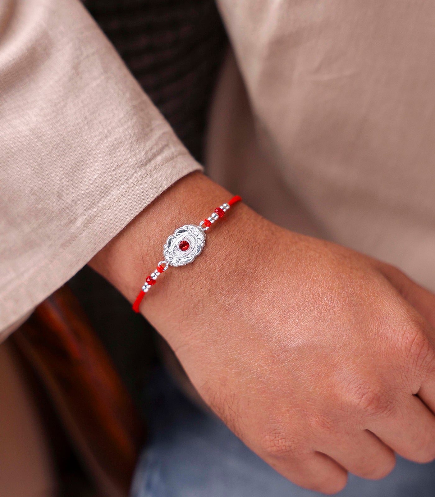 Silver Red Stone Oval Shaped Rakhi