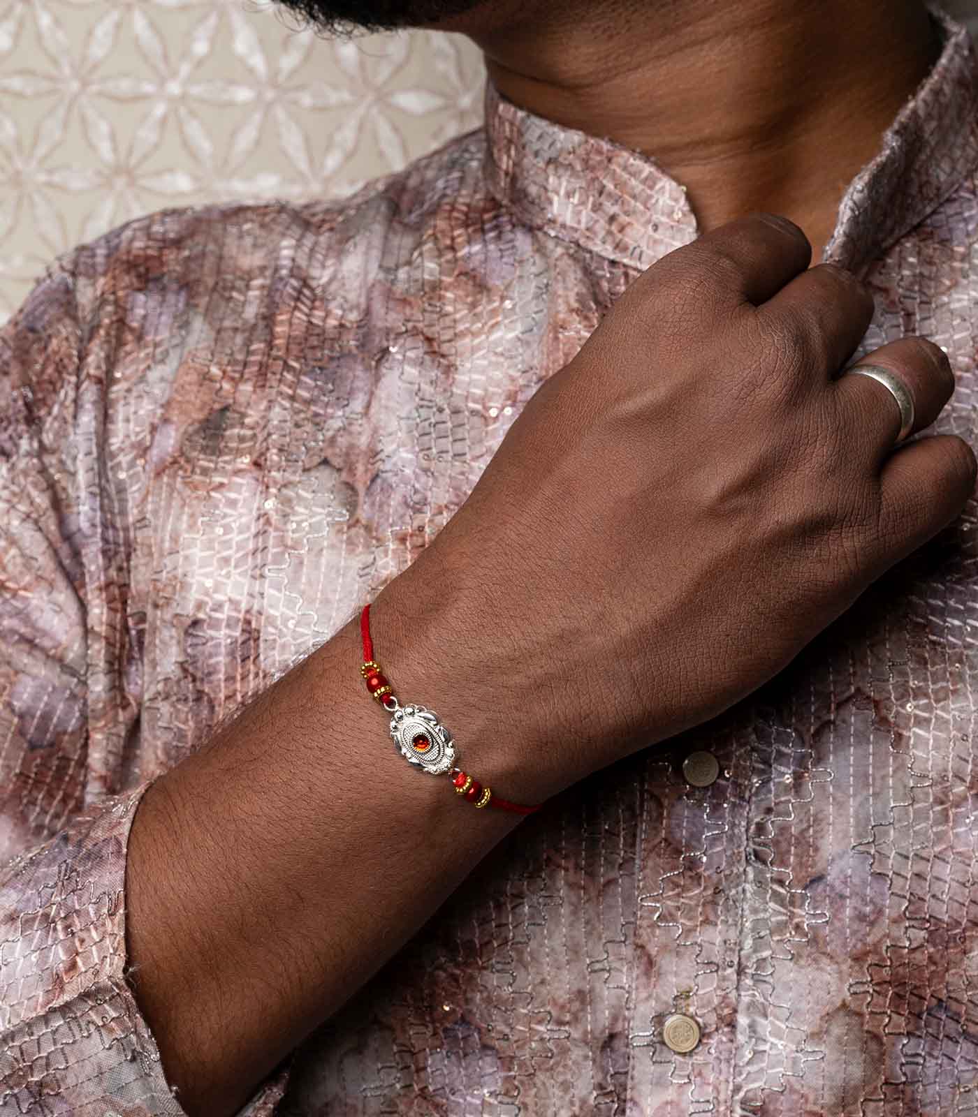 Silver Red Stone Oval Shaped Rakhi