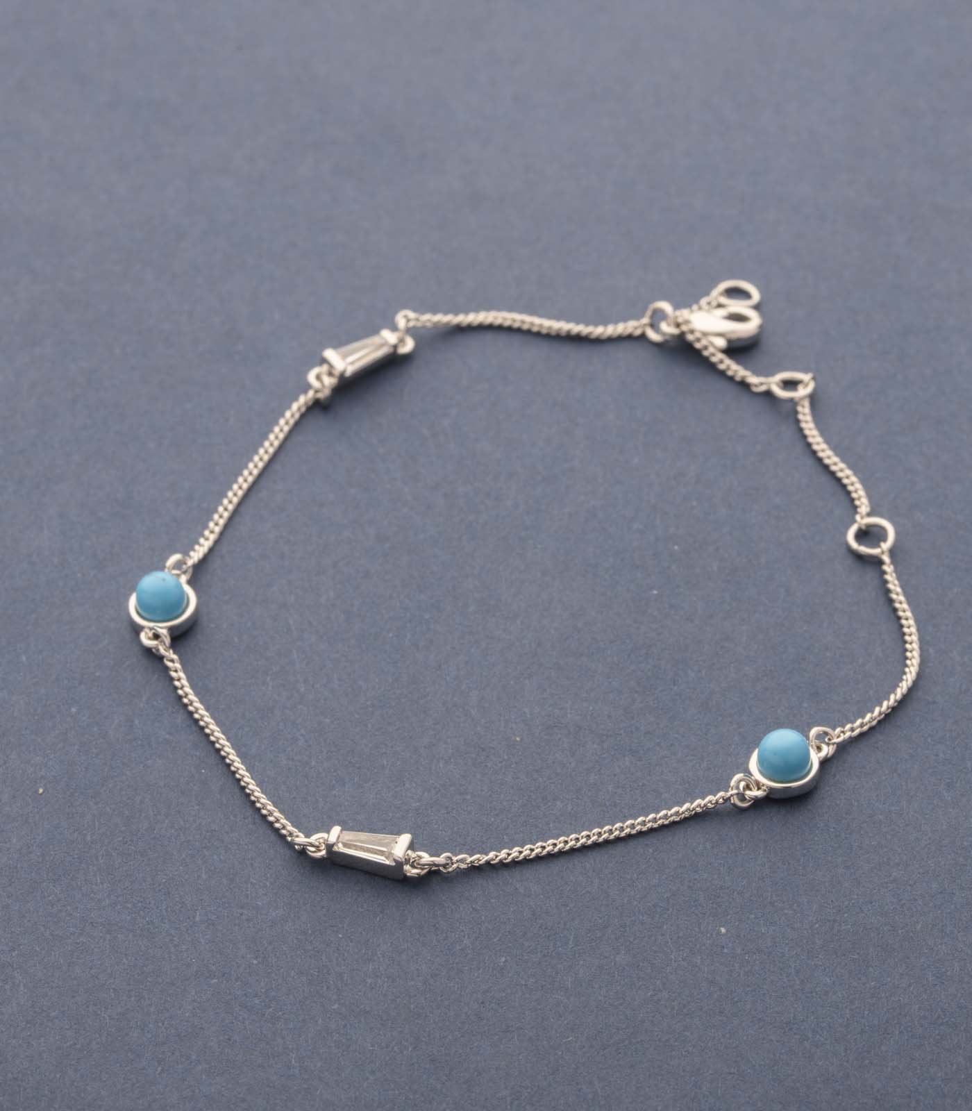 Sophisticated Silver String Of Blue Dots Bracelet (Brass)